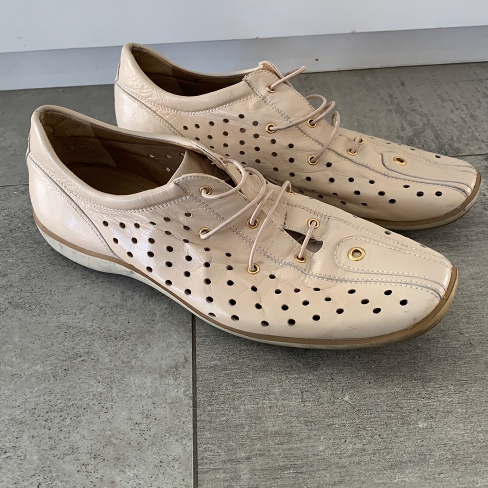 Stuart Weitzman cream leather slip-ons with gold details, size 9.5